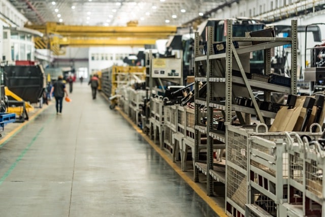 Assembly room at big industrial plant manufacturing tractors and harvesters